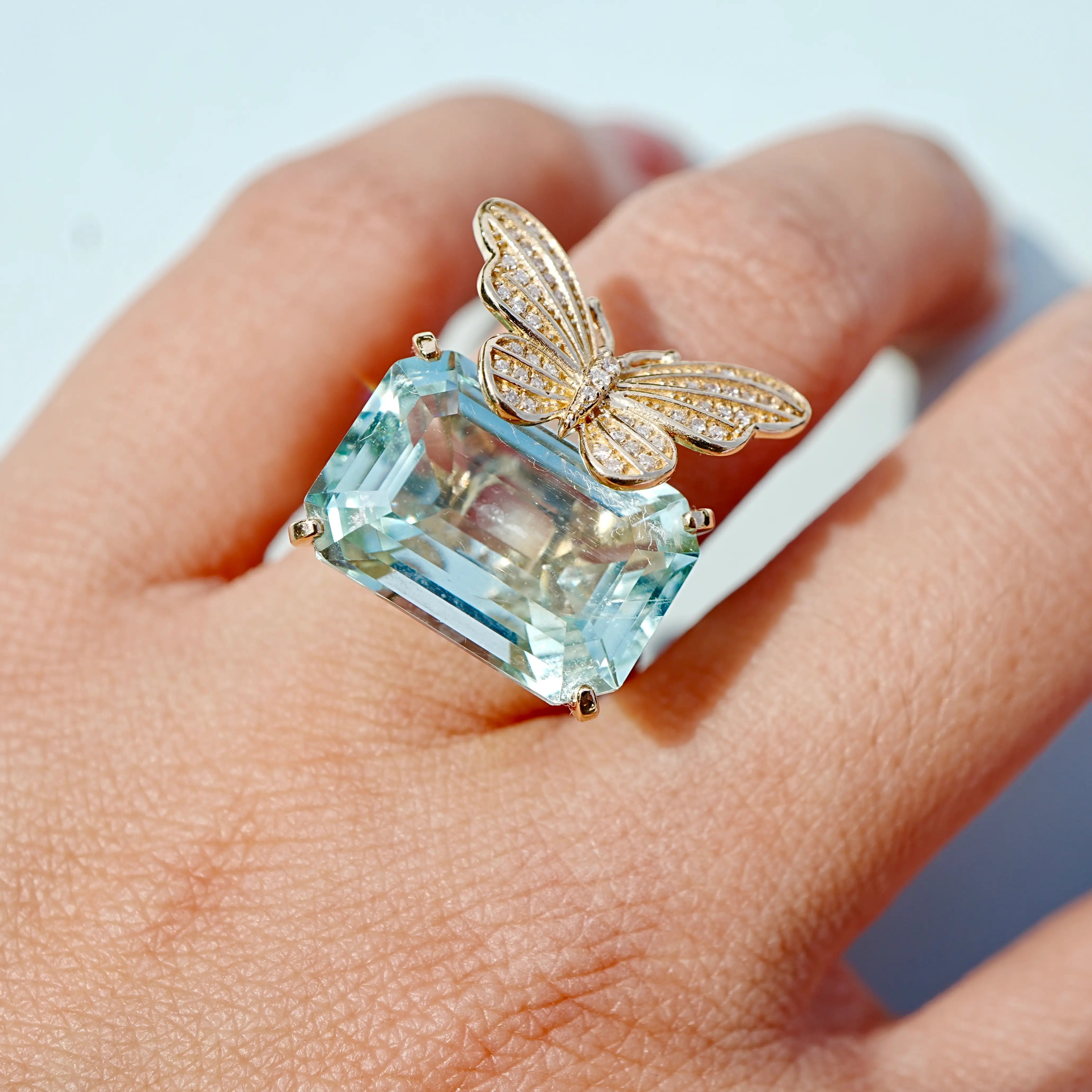 Nina Zhou x Kai Natural Diamond Butterfly on 10.70ct Aquamarine Ring in 14k yellow gold (One-of-a-Kind)