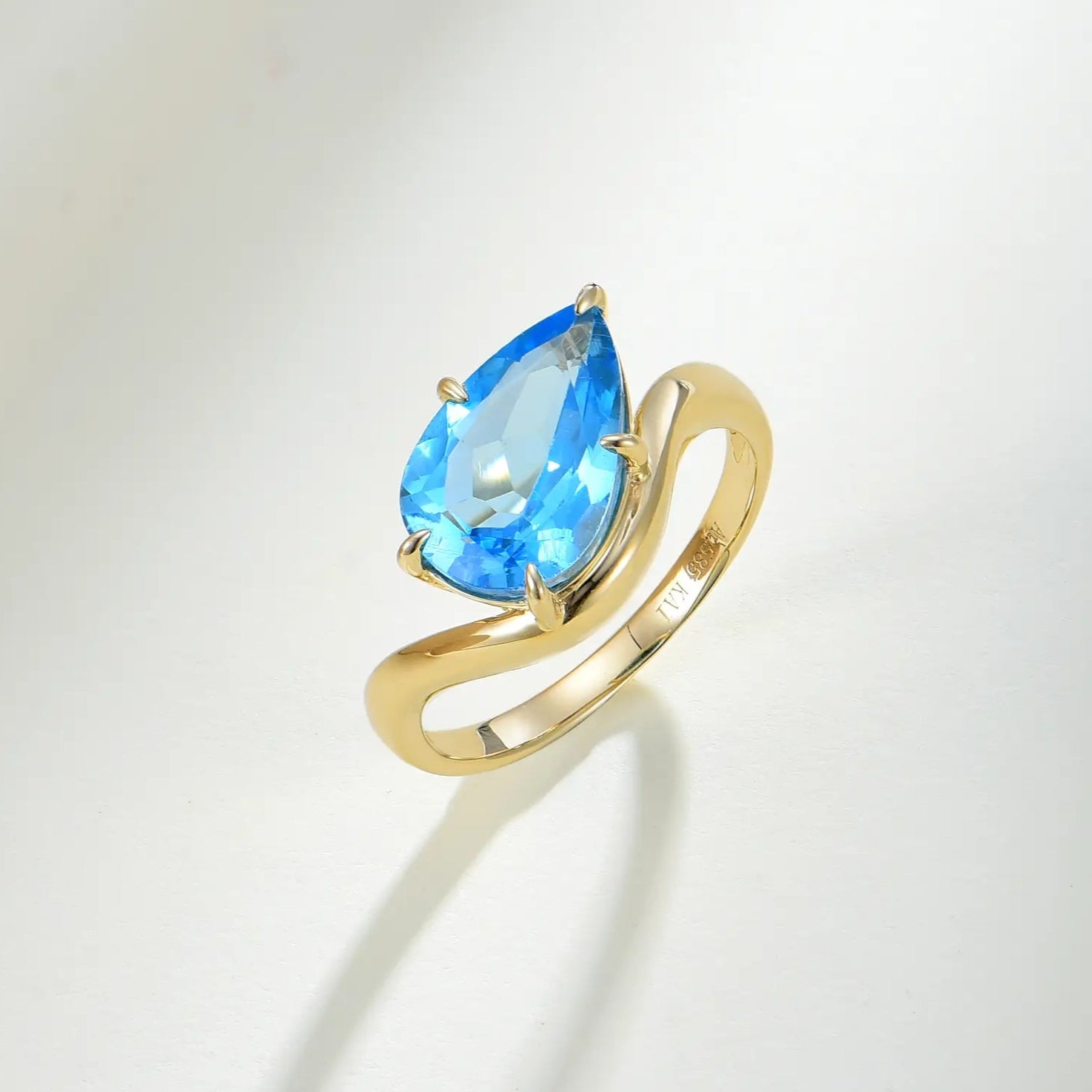 Ocean Wave Swiss Blue Natural Oval Topaz East-West Ring in 14k yellow gold