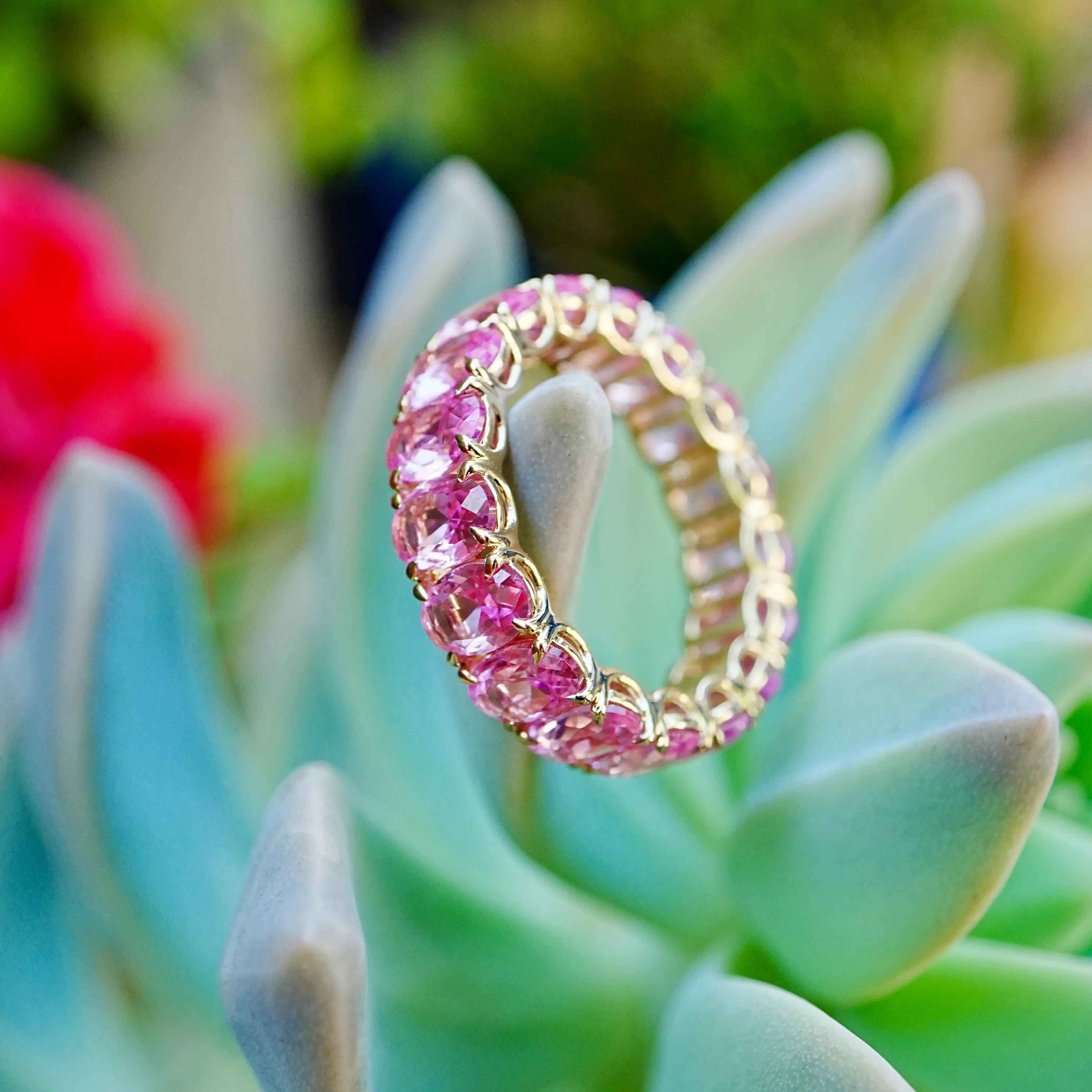 Nora 11.50 ctw Oval Lab Grown Pink Sapphire Eternity Ring in 14k yellow gold