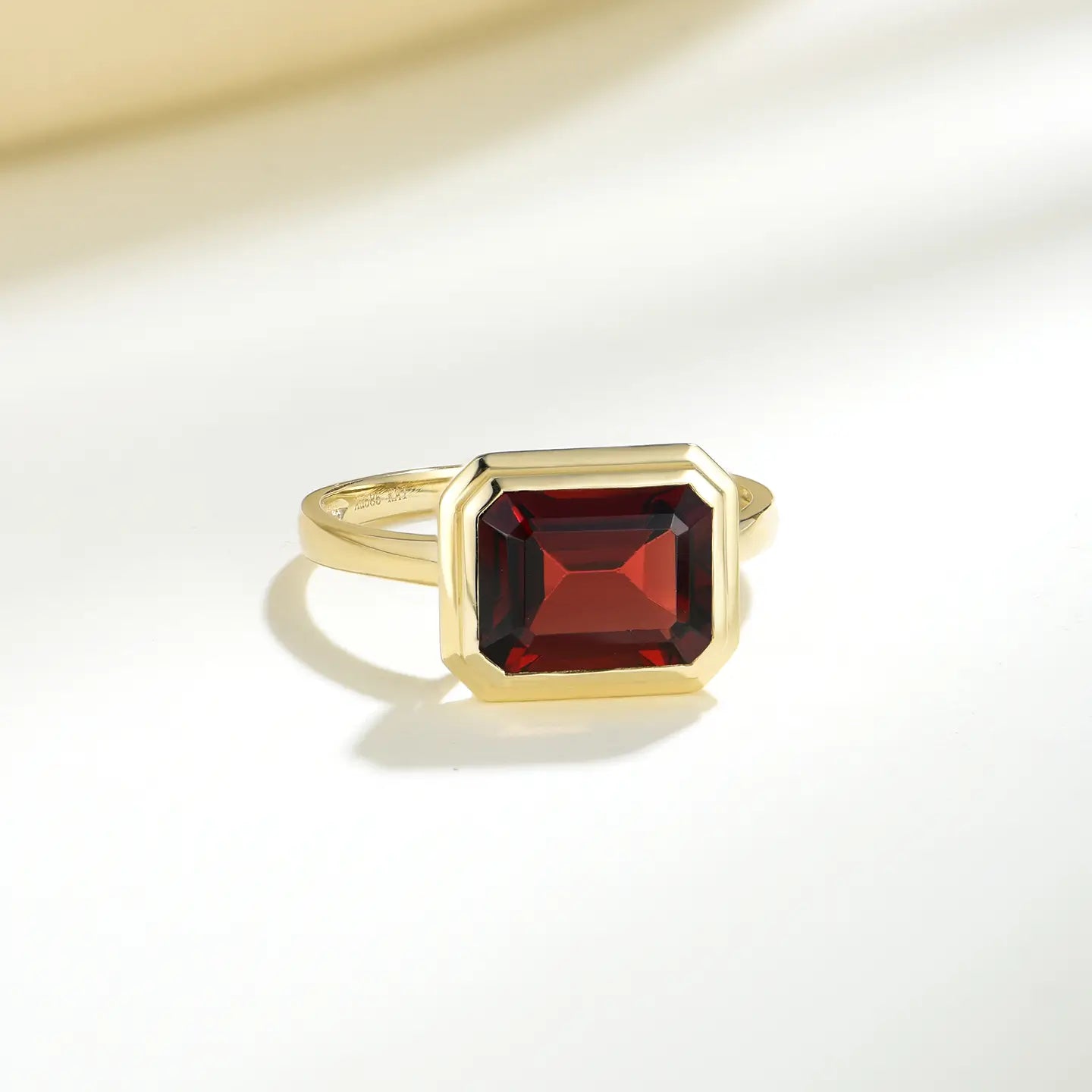 east west design red gemstone ring