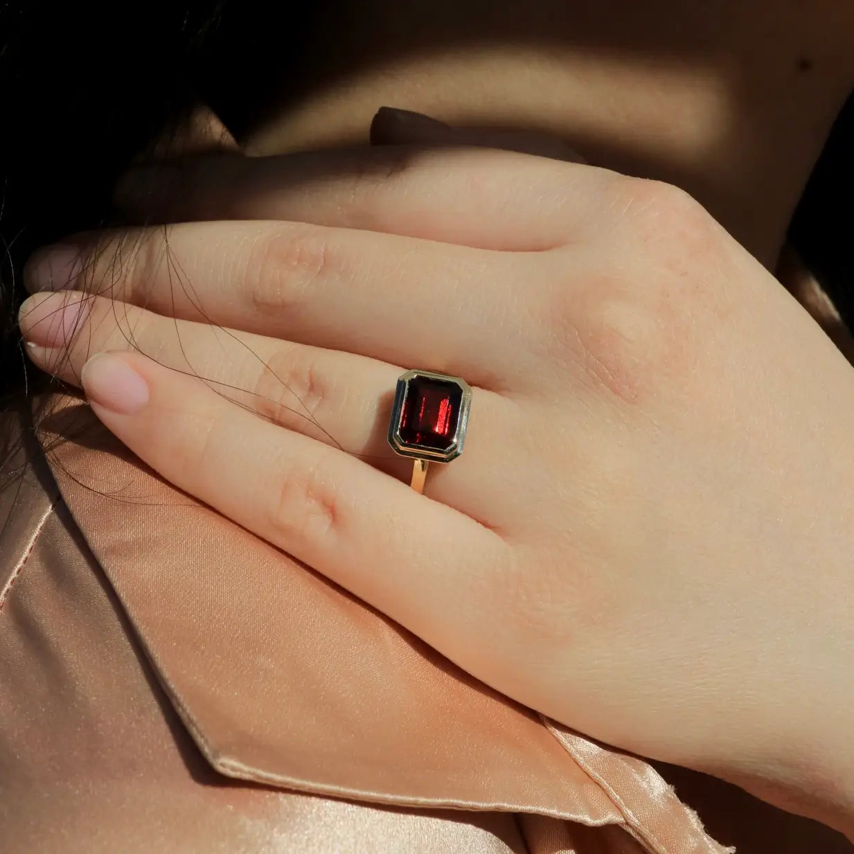 red garnet gemstone east west ring