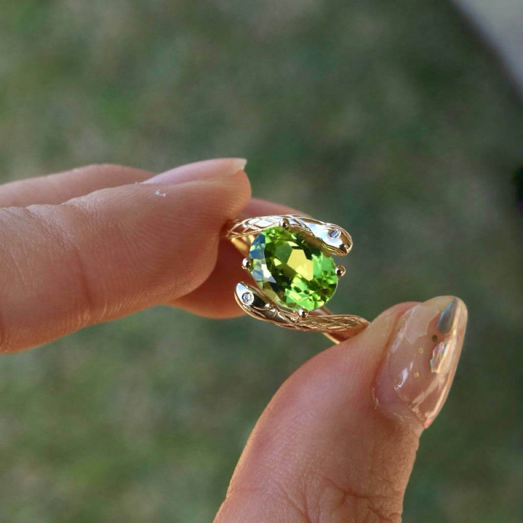 oval peridot diamond snake ring 14k gold