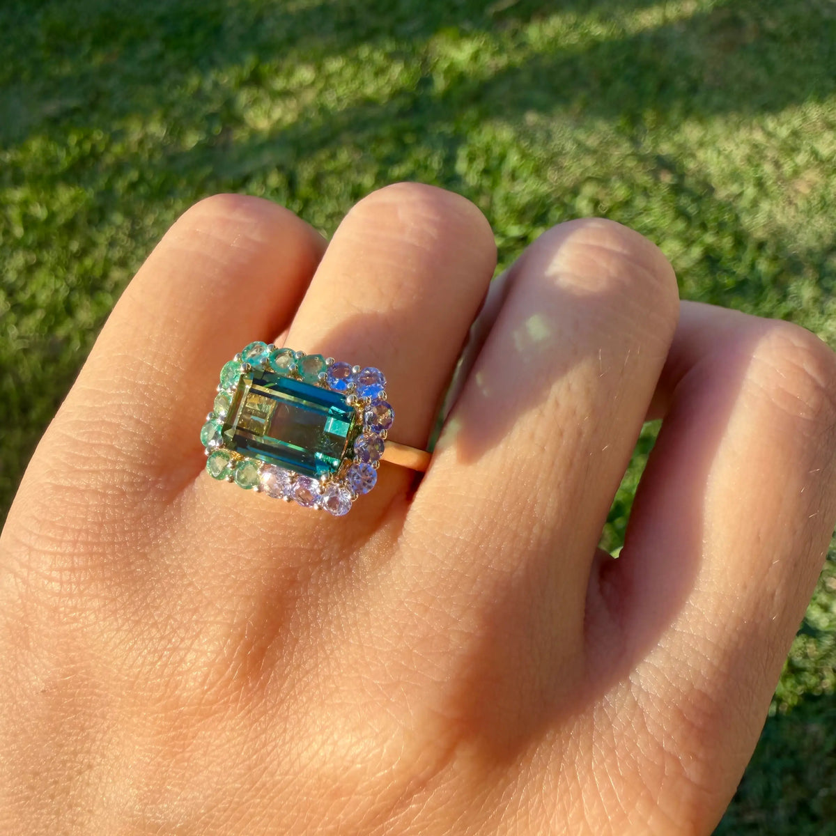 14k yellow gold Eden Halo 4.36 ctw Natural Bi-Color Teal Toumaline, Emerald & Tanzanite East-West Ring (One-of-a-Kind)